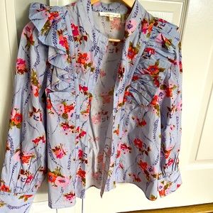 button down with ruffle shoulders.